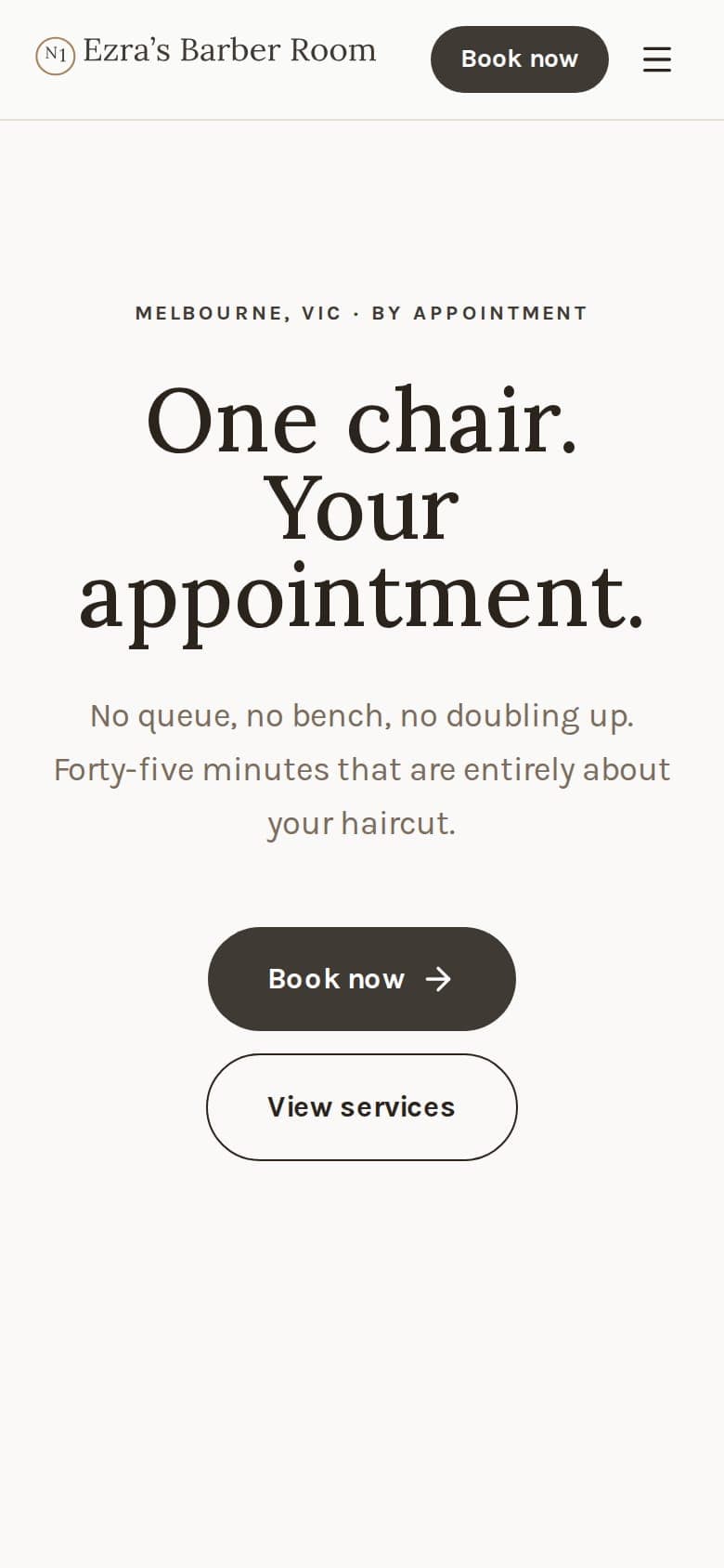 Ezra's Barber Room website on a phone