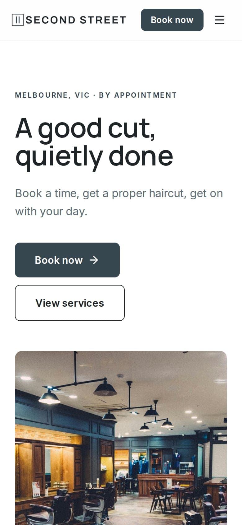 Second Street Barbers website on a phone